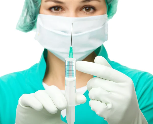 Young nurse is preparing syringe for injection — Stock Photo, Image