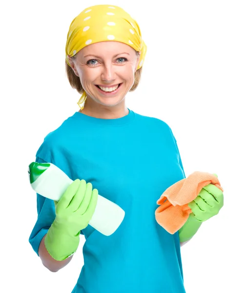 Young woman with cleaning liquid and rag — Stock Photo, Image