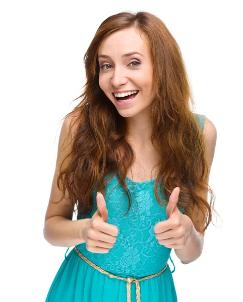 Woman is showing thumb up gesture — Stock Photo, Image