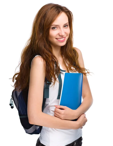 Joven estudiante chica está sosteniendo libro —  Fotos de Stock