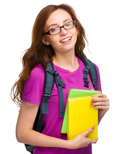 Joven estudiante chica está sosteniendo libro —  Fotos de Stock