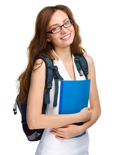 Joven estudiante chica está sosteniendo libro — Foto de Stock