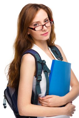 Genç öğrenci kız kitap tutuyor