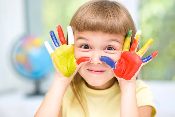 Portrait of a cute girl playing with paints — Stock Photo, Image