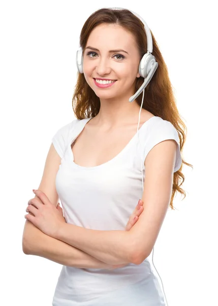 Lovely young woman is talking to customers — Stock Photo, Image