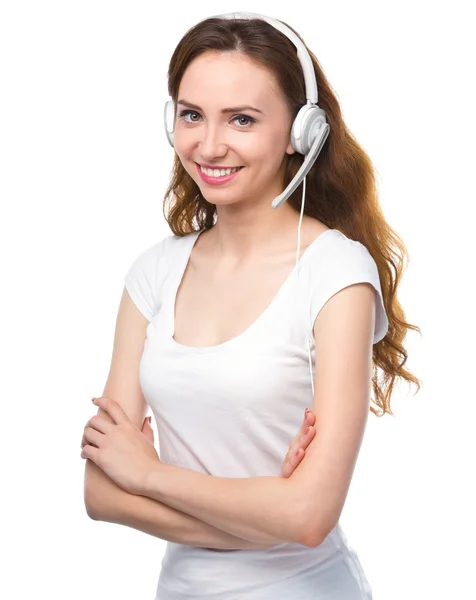 Lovely young woman is talking to customers — Stock Photo, Image