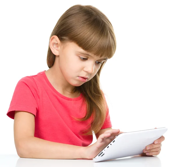 Young girl is using tablet — Stock Photo, Image