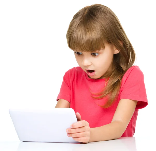 Young girl is using tablet — Stock Photo, Image