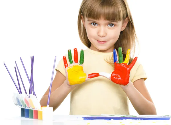 Portrait of a cute girl playing with paints — Stock Photo, Image