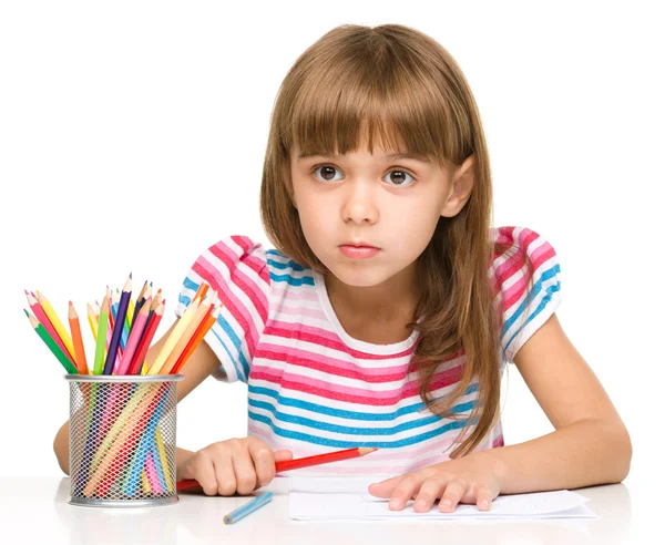 Little girl is drawing using pencils — Stock Photo, Image