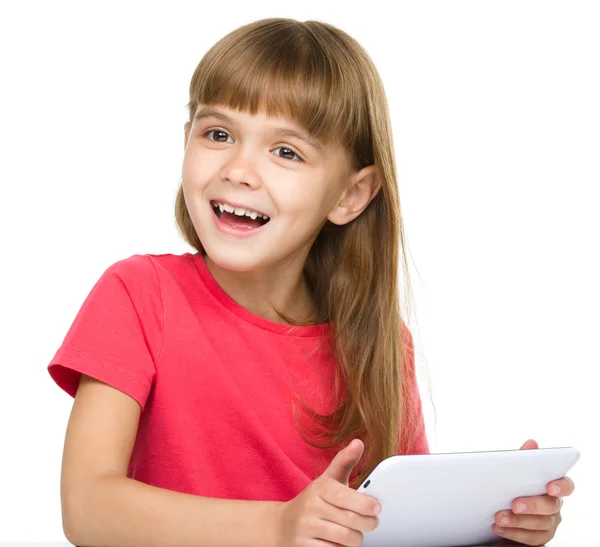 Young girl is using tablet — Stock Photo, Image