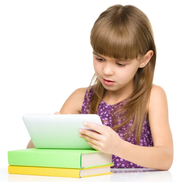 Young girl is using tablet — Stock Photo, Image