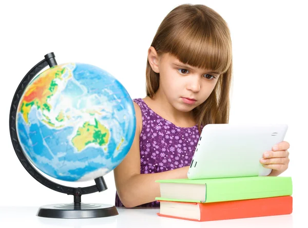 Young girl is using tablet — Stock Photo, Image