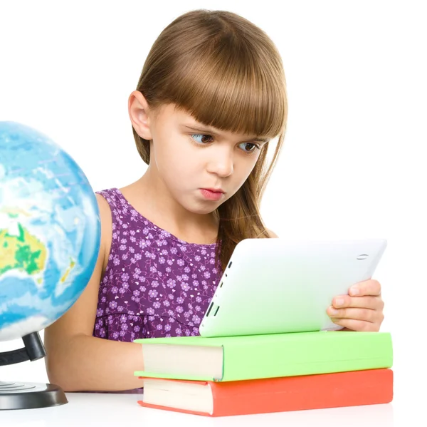 Young girl is using tablet — Stock Photo, Image