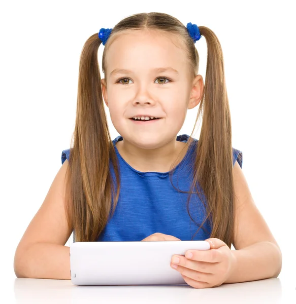 Young girl is using tablet Royalty Free Stock Photos