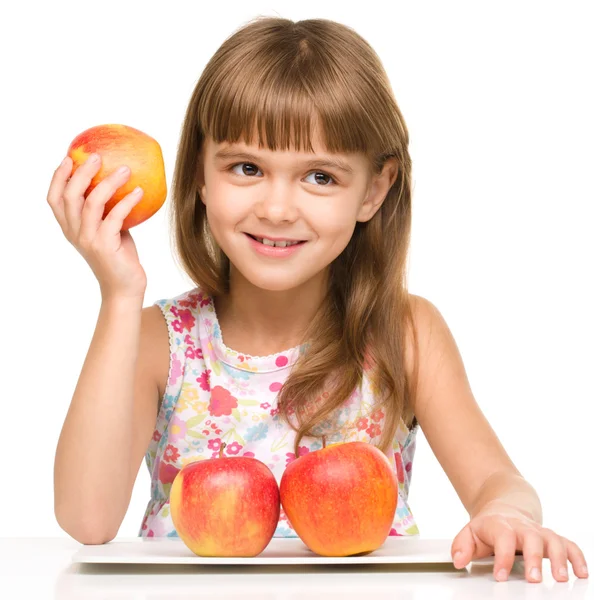 Petite fille aux pommes rouges — Photo