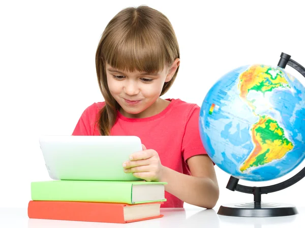 Young girl is using tablet — Stock Photo, Image