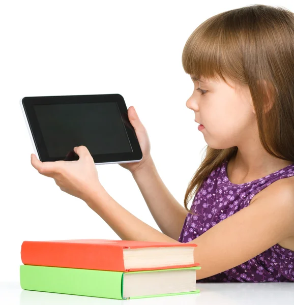 Young girl is showing tablet — Stock Photo, Image