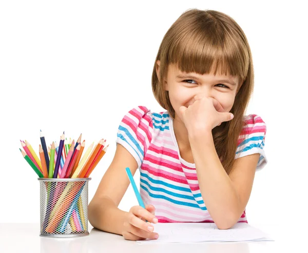 Little girl is drawing using pencils — Stock Photo, Image