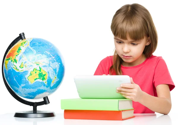 Young girl is using tablet — Stock Photo, Image