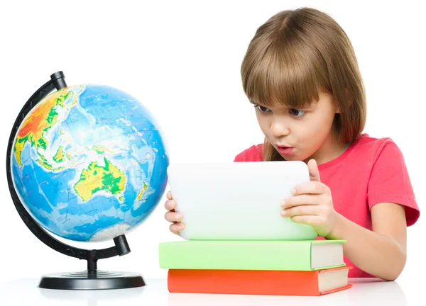 Young girl is using tablet while studying — Stock Photo, Image