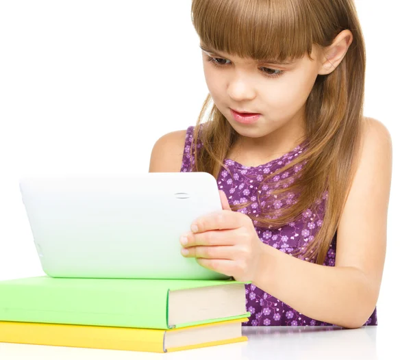 Young girl is using tablet — Stock Photo, Image