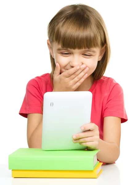 Young girl is using tablet while studying — Stock Photo, Image