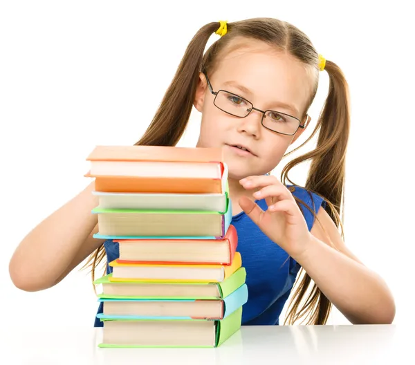 Little girl with books Stock Picture