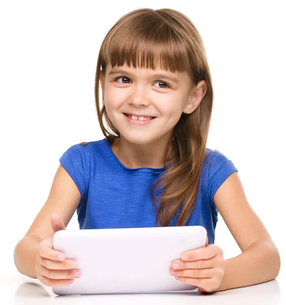 Young girl is using tablet — Stock Photo, Image