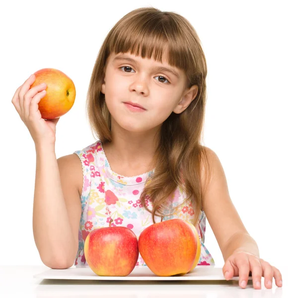 Niña con manzanas rojas —  Fotos de Stock