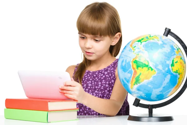 Young girl is using tablet — Stock Photo, Image