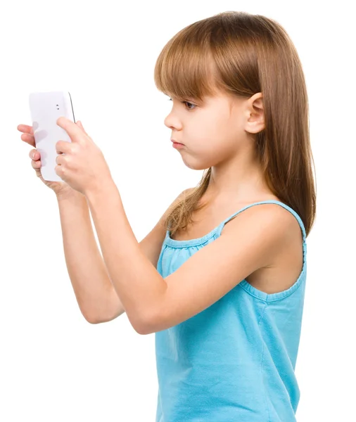 Young girl is using tablet Royalty Free Stock Images