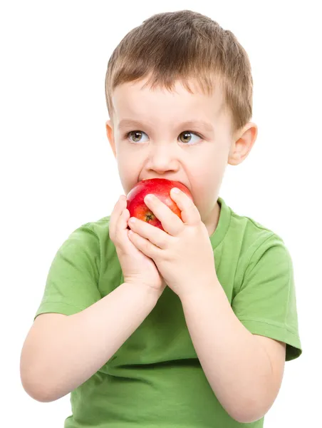 Portrait of a cute little boy with red apple — Stock Photo, Image