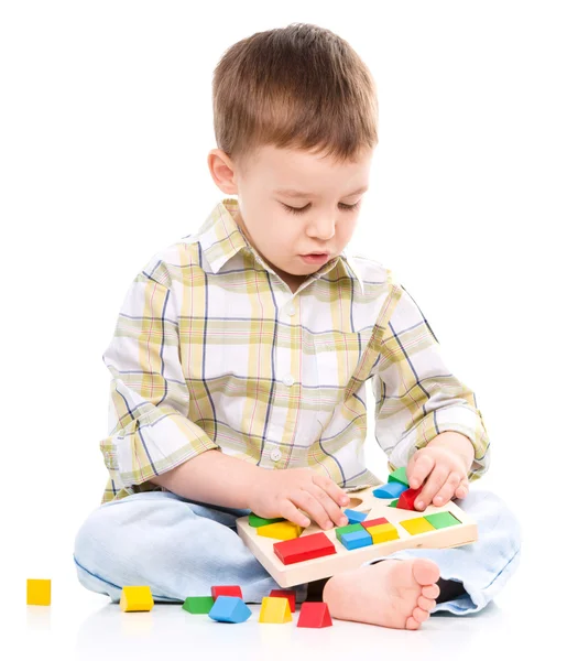 Little boy is playing with toys Stock Photo