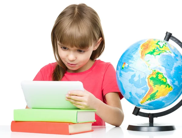 Young girl is using tablet — Stock Photo, Image