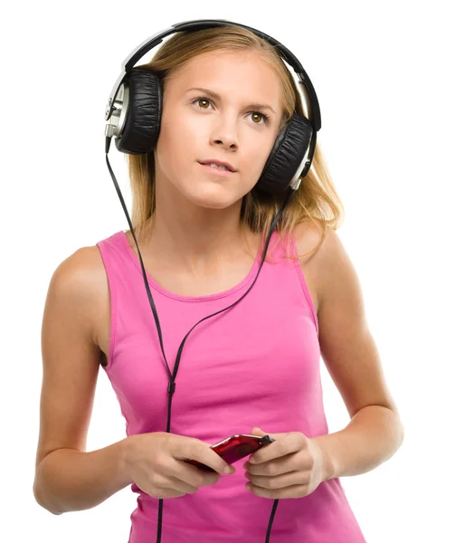 Teen girl enjoying music using headphones — Stock Photo, Image