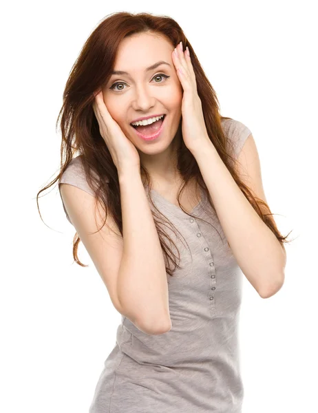 Woman is holding her face in astonishment — Stock Photo, Image