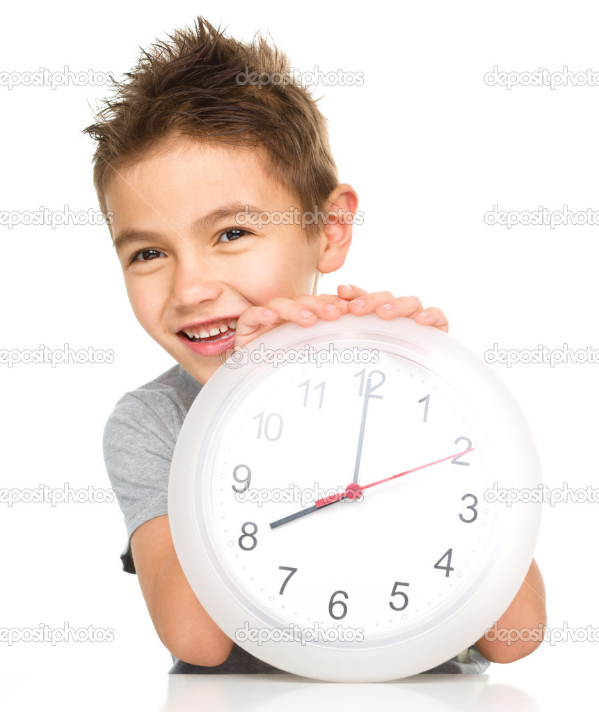 Boy is holding big clock