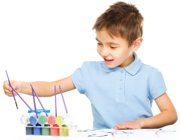 Boy is playing with paints — Stock Photo, Image