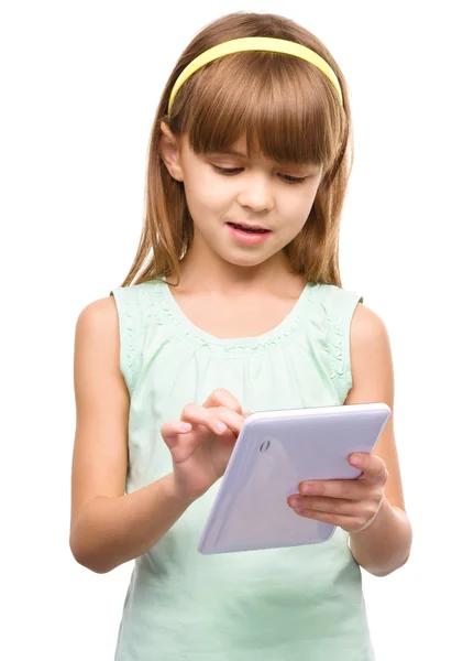 Young girl is using tablet — Stock Photo, Image