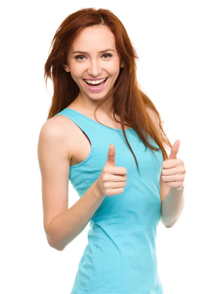 Woman is showing thumb up gesture — Stock Photo, Image