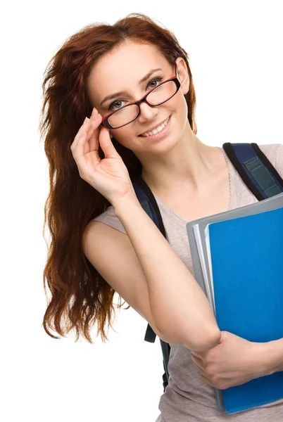 Joven estudiante chica está sosteniendo libro —  Fotos de Stock