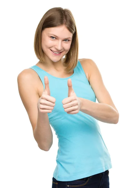 Žena ukazuje palcem nahoru gesto — Stock fotografie