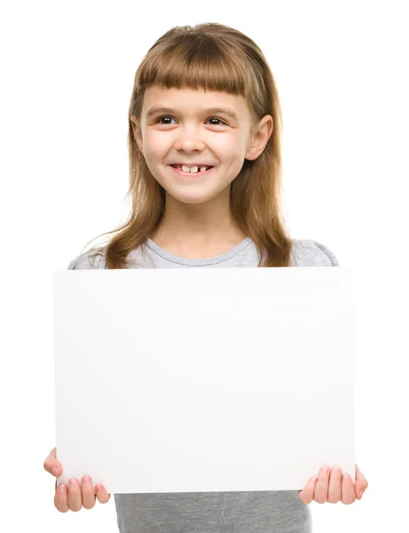 Little girl is holding blank banner — Stock Photo, Image
