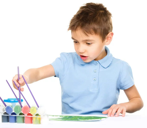 Boy is playing with paints Stock Picture