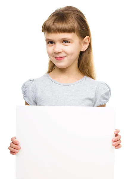 Little girl is holding blank banner — Stock Photo, Image