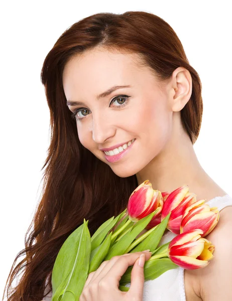 Young woman is holding bouquet of tulips — Stock Photo, Image