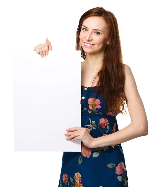 Young woman is holding blank banner — Stock Photo, Image