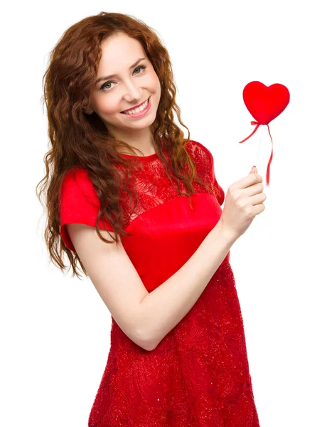 Young woman holding small red heart — Stock Photo, Image