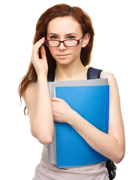 Ung student tjej håller boken — Stockfoto